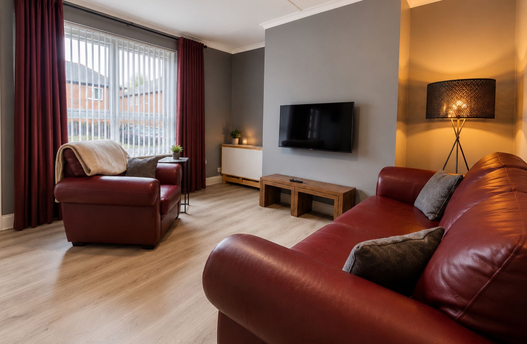 The living room at Canny Hyem with the lamps on